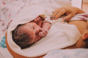 Tender Moment of a Newborn with Mother